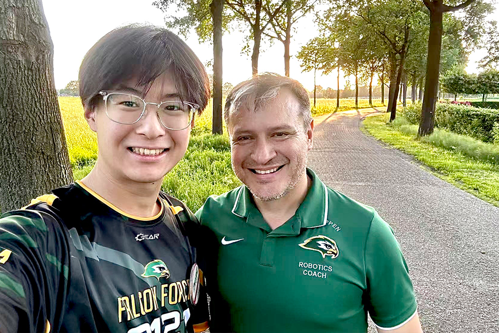 Team member and coach selfie outdoors